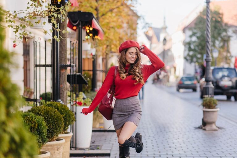 young woman in red beret