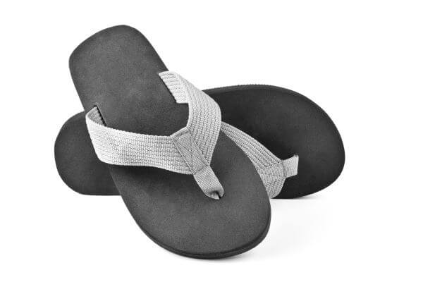 Black and grey flip flops with canvas strap