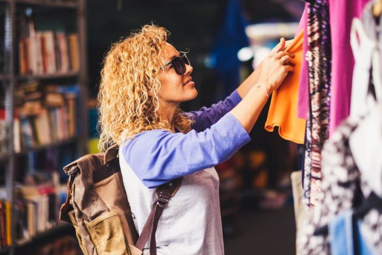 woman buying second hand clothes